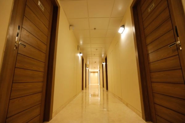 Carpeted and Lit Floor Corridor